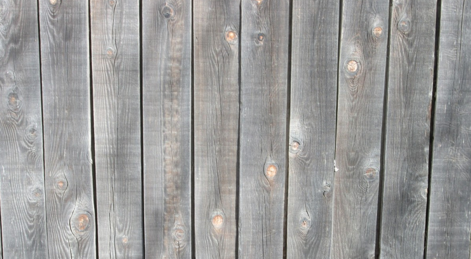 The photo shows redwood fence in Carmichael California